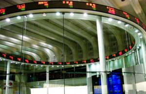 MEXC Appoints Robert MacDonald Chief Compliance Officer as Exchange Expands Into Tokenized Markets Trading screens on the market floor of a stock exchange