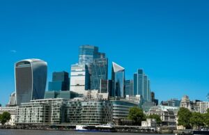 Adviser fees on UK takeovers pass 1.2 billion pounds as London deal wave builds The City of London financial district skyline seen across the Thames
