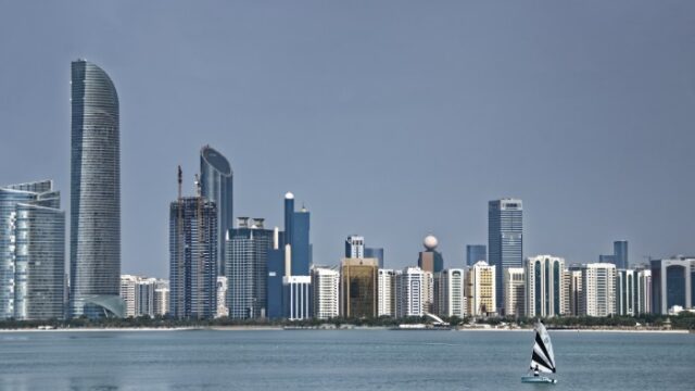 Abu Dhabi skyline seen across the water in daylight
