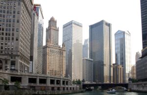 Aon Agrees 17 Billion Dollar Acquisition of USI Insurance Services from KKR Chicago skyline, a major operating base for Aon
