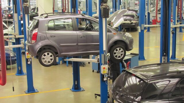 Vehicle on a lift in an automotive service workshop
