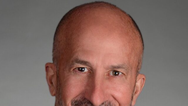 John G. Rice, chair of the board, AIG