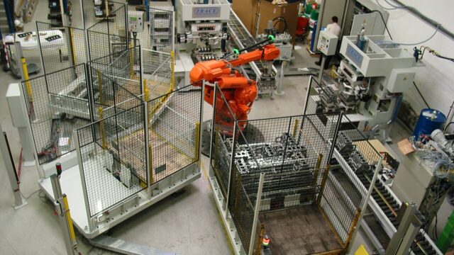 Industrial robot cell on a factory floor