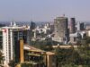 Grit Real Estate accepts a conditional binding offer for its development platform and progresses a proposed portfolio disposal Daylight view of an African city commercial district with office towers and tree cover, a generic stock illustration that does not depict any property owned or managed by the companies named in this report.