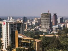 Grit Real Estate accepts a conditional binding offer for its development platform and progresses a proposed portfolio disposal Daylight view of an African city commercial district with office towers and tree cover, a generic stock illustration that does not depict any property owned or managed by the companies named in this report.