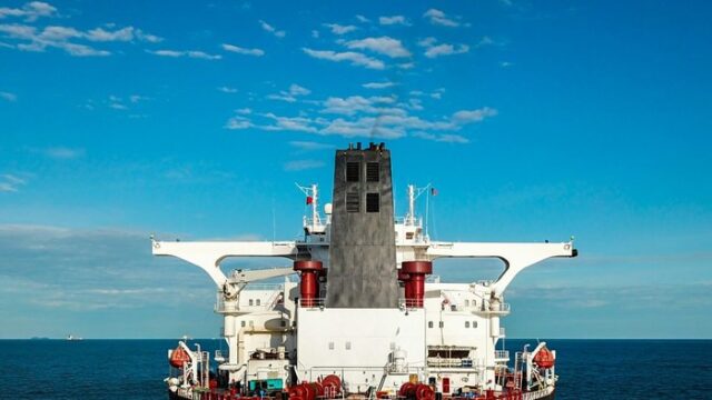 Crude oil tanker superstructure and deck gear seen from astern at sea under a clear blue sky, a generic illustration for a tanker newbuilding order report.
