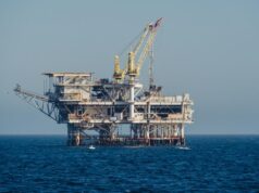 ADES Holding signs SAR 173m jack-up contract with Indonesia’s Pertamina Hulu Mahakam Offshore oil and gas platform standing in open blue sea under clear daylight, a generic illustration for an offshore jack-up drilling contract report.