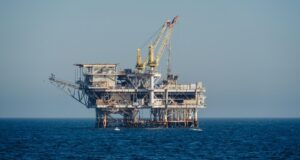ADES Holding signs SAR 173m jack-up contract with Indonesia’s Pertamina Hulu Mahakam Offshore oil and gas platform standing in open blue sea under clear daylight, a generic illustration for an offshore jack-up drilling contract report.