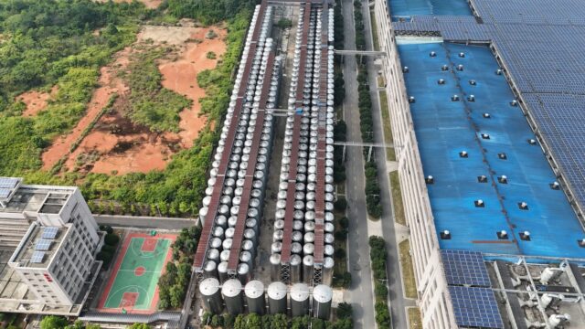 Aerial view of an industrial complex with rooftop solar arrays in China