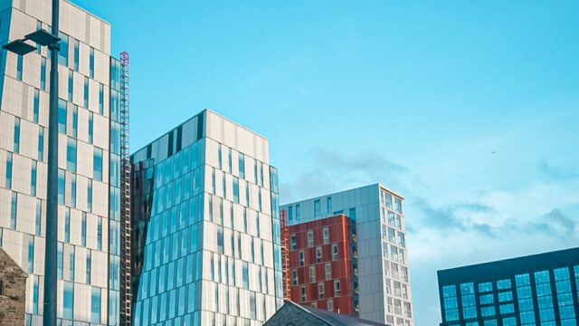 Daylight view of modern and historic buildings in the Dublin docklands, the city hosting CATEX 2027